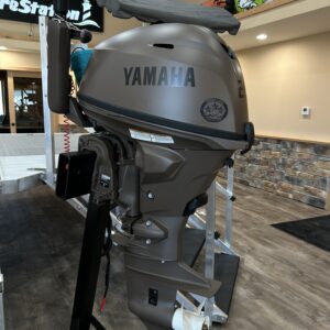 A 2023 25HP Yamaha 4 Stroke Tiller is on display in a store.