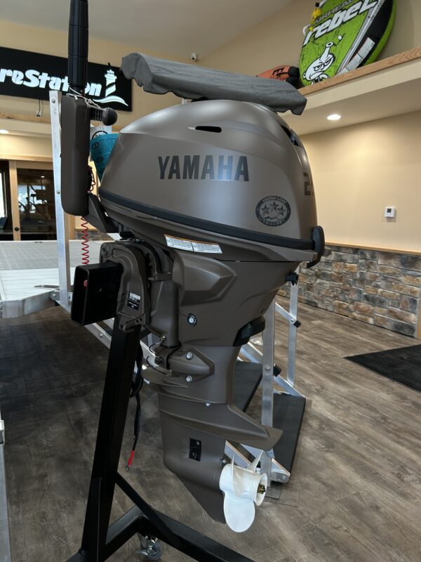 A 2023 25HP Yamaha 4 Stroke Tiller is on display in a store.