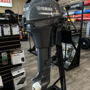 A 2023 9.9 Yamaha 4 Stroke Tiller is on display in a store.