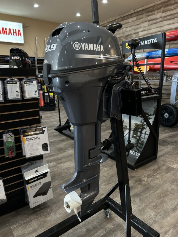 A 2023 9.9 Yamaha 4 Stroke Tiller is on display in a store.