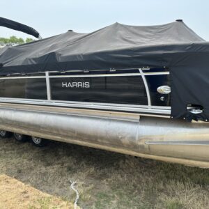 A 2019 Harris Tritoon 25' Pontoon with a cover on it.