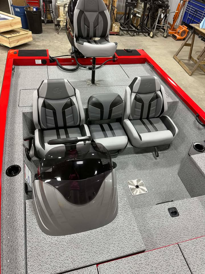 Red-trimmed bass boat deck with seats