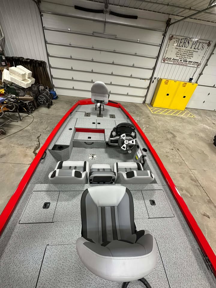 Red bass boat deck with gray seats