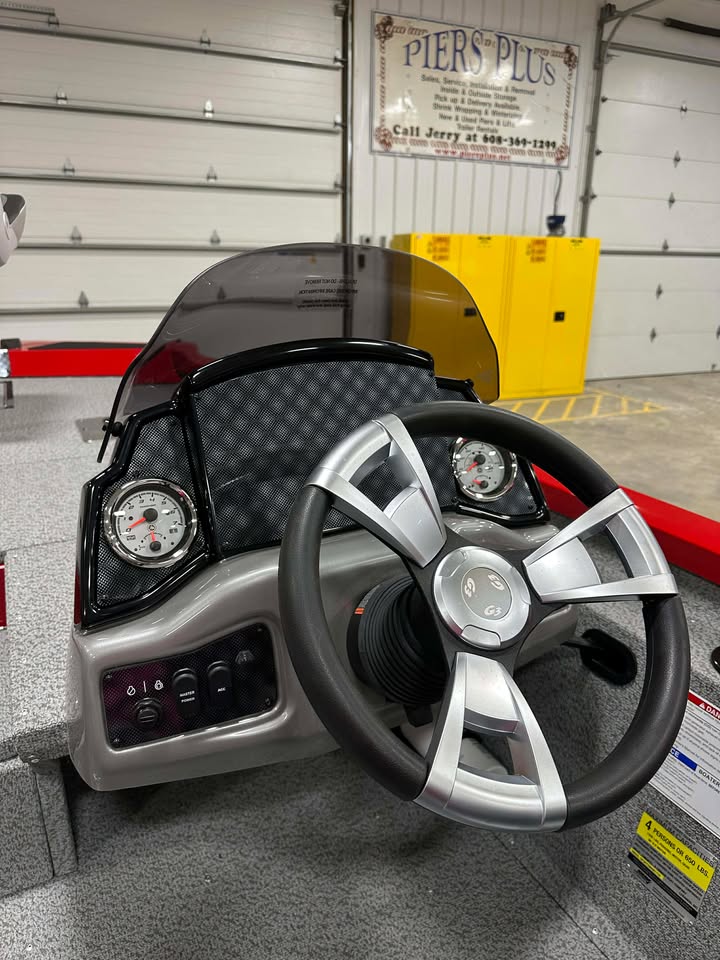 Boat console with steering wheel and gauges