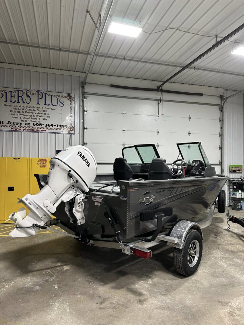 Black aluminum fishing boat with Yamaha outboard
