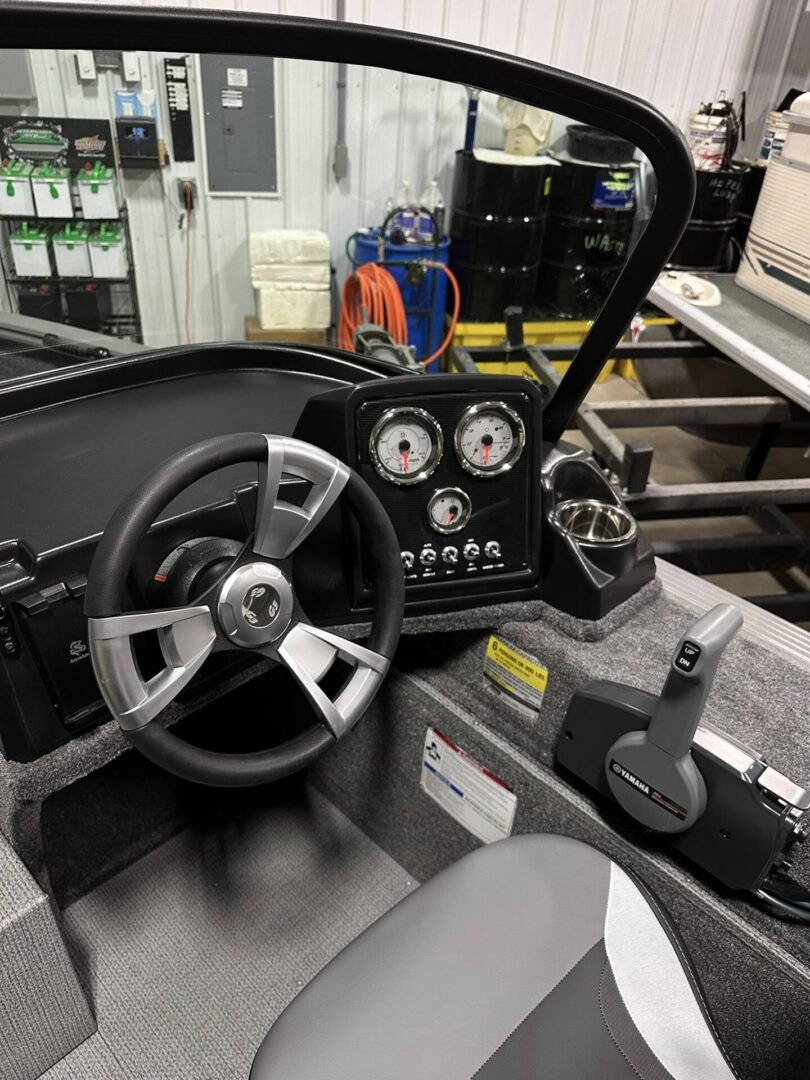 Boat helm console with wheel, gauges, throttle