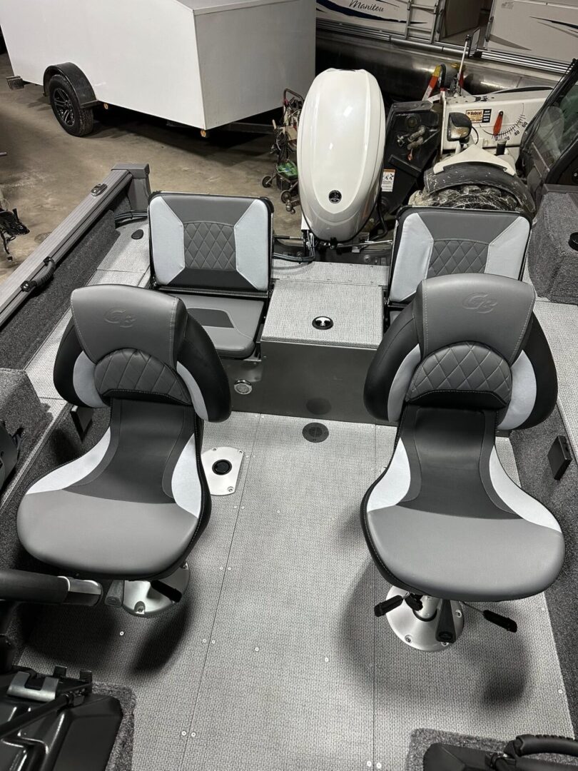 Fishing boat interior with four gray seats