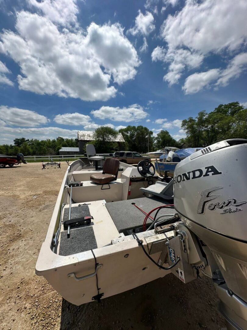 Small fishing boat with Honda outboard motor