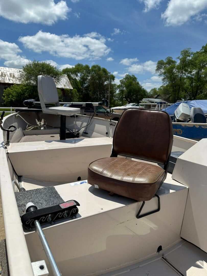 Worn brown seat in small open boat