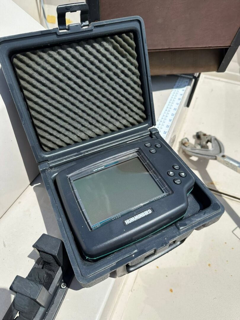 Portable fishfinder in foam-lined protective case